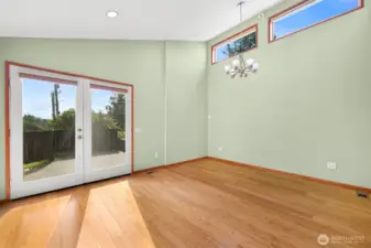 Primary suite with doors to private fenced back patio.