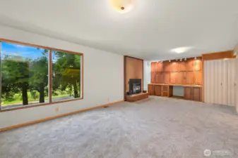 Family room with fireplace, and tons of built ins.