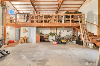 Looking up at loft area. Door below is to the shop bathroom.