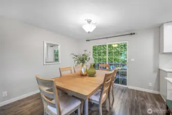 A second view of the dining area shows how seamlessly it connects to the kitchen. Its placement makes hosting gatherings effortless and enjoyable.