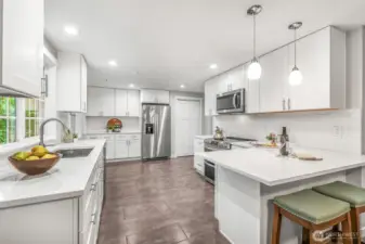 The kitchen offers abundant cabinetry, sleek counters, and stainless steel appliances. Its modern design combines both style and functionality, making meal prep enjoyable and efficient.