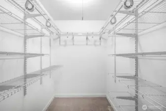 The walk-in closet provides excellent storage with adjustable shelving, ensuring space for clothing and personal items is both organized and accessible.