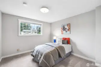 The third bedroom offers comfortable space and natural light, perfect for use as a guest room, home office, or personal retreat.