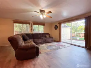 Unit A- Living Room with access to fully fenced private backyard