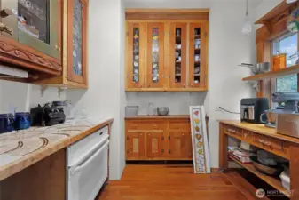The butler's pantry with an oven and plenty of storage and counterspace.