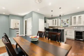 Enjoy an open-concept layout that connects the elegant dining space to a beautifully updated kitchen. Wine storage in the shelves and the included wine refrigerator.