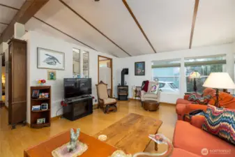 Large living room with comfortable warmth from the gas stove.