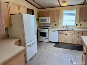 Large kitchen with plenty of storage and natural light.