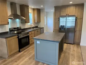 Kitchen with plenty of storage and an island too.