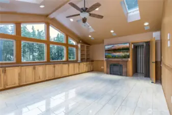 Huge bonus room has peekaboo Lake Tapps view, tons of storage, fireplace, skylights, heated tile floor and an elevator!