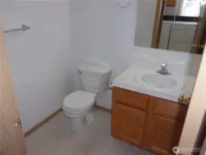 Handy half-bath near the laundry room.