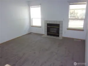 Living room features gas fireplace.