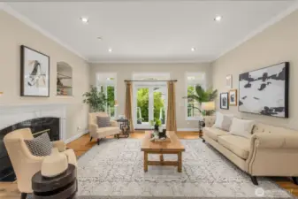 Spacious living room with french doors out to the wrap around covered back deck