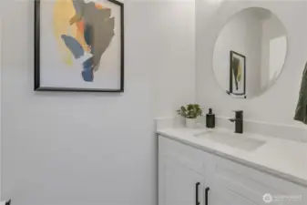 Fully renovated powder room with new sink, vanity and toilet