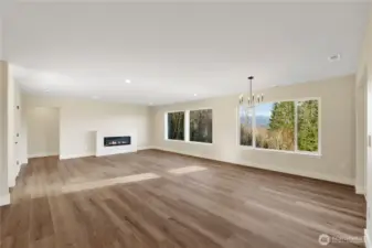Large family room with electric fireplace.