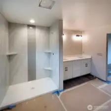 Walk in tile shower, double vanity!