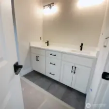Primary bath with dual vanity.