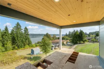 Covered porch will have trex surface & black railing. Wired for future ceiling fan as well!