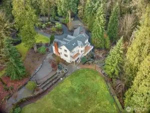 Parking for over 50 cars with multiple outbuildings and sports court