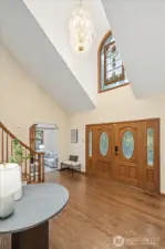 Gorgeous hardwood floors and soaring entryway