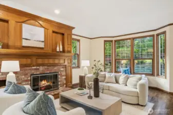 Grand fireplace mantel and gas fireplace in living room