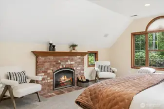 Cozy fireplace in primary bedroom