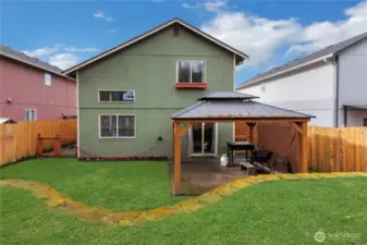 Large patio and covered BBQ area