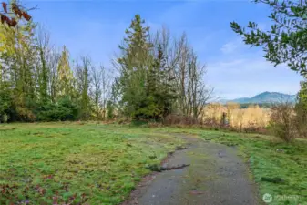 Approaching North access view point. Bluff upfront and center. Cascades in distance. Arlington Land.