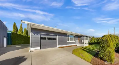 Attached garage and ample parking and mature privacy landscaping