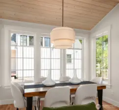 A cozy spot with lots of room for dinner with family and friends, overlooking the fenced rear yard and lush open spaces.