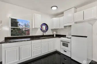 Kitchen has new countertops, new fridge & stove