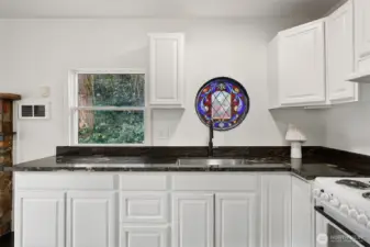 Look at this adorable window above the kitchen sink.