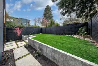 Sunny landscaped backyard. Fully fenced and private.