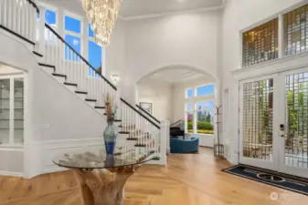 Stunning new wide plank hardwood floors and new crystal chandelier are sure to impress.