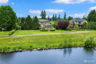 Picture-perfect setting nestled on a 1/2 acre with a water view, on the iconic Echo Falls golf course!