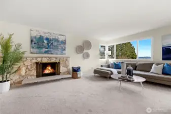 Living room features a wood-burning fireplace and new carpet and paint.