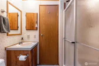 This 3/4 bath conveniently opens to the laundry room and the hallway