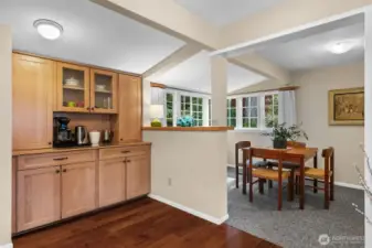A floor-to-ceiling built-in cabinet offers extra storage and the perfect spot for a wine or coffee center.