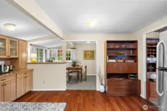 The open and spacious kitchen flows into a nearby dining area, ideal for hosting both formal dinners and casual gatherings