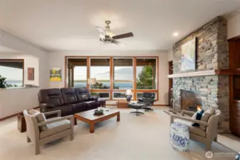 Main floor Living Room . The large windows maximize the gorgeous views of the Puget Sound and Cascades.