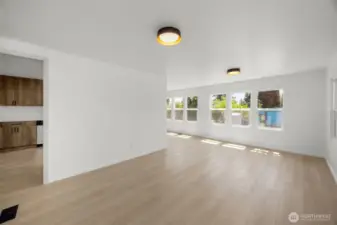 Enter the home into this spacious, light-filled living area