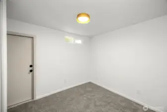 3rd bedroom at north end of the home. This door leads out to the back deck.