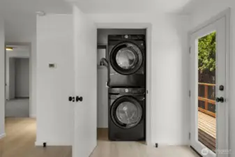 Brand new washer/dryer set in laundry closet off the kitchen