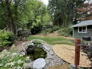 Amazing water feature in the front yards provides a peaceful place to relax