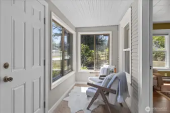 Sunny, enclosed front porch for sitting ...