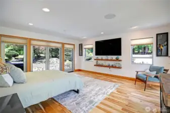 Spacious Master Suite with your large TV and floating shelves.