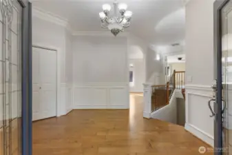 Step through elegant double doors into a spacious foyer that immediately sets the tone for this home’s generous layout. From here, you’ll have easy access to both the formal living room and formal dining room—perfect for hosting guests or enjoying intimate family dinners.
