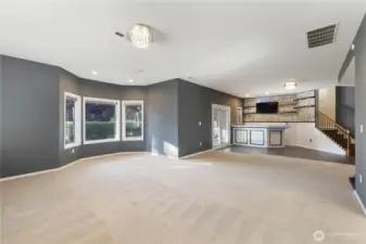 A huge rec room with a built-in bar, patio access, and a view of the backyard provides the ultimate retreat. Whether you’re hosting game nights, celebrating special occasions, or simply unwinding after a long day, this space offers both comfort and versatility