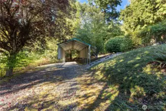 Extra parking space with covered area for an RV or boat.