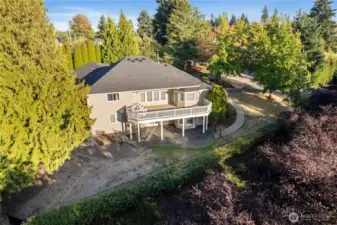 The home is located on a landscaped and fenced lot with storage shed, patios, deck, dog run, sprinkler system, fruit trees and more!